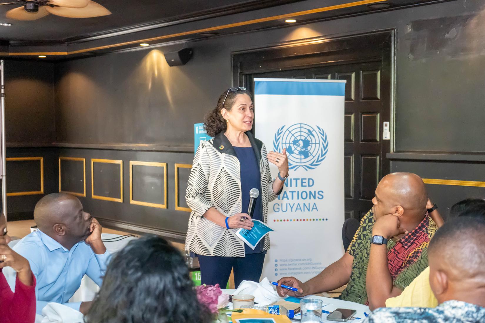 UN Resident Coordinator in Guyana Yeşim Oruç engages media editors.