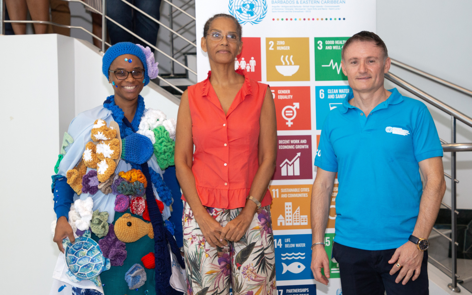 Winner of the SDG Costume Competition, Nikisha Toppin from FAO, is congratulated by UN Resident Coordinator, Didier Trebucq and FAO Sub-regional Coordinator, Dr. Renata Clarke.  