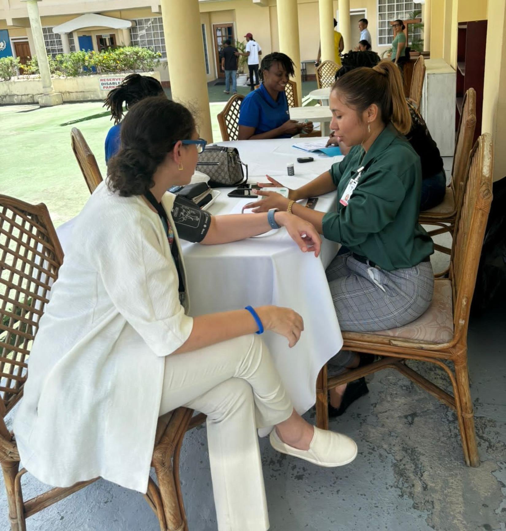 UN Resident Coordinator in Guyana Yeşim Oruç participates in the health fair.