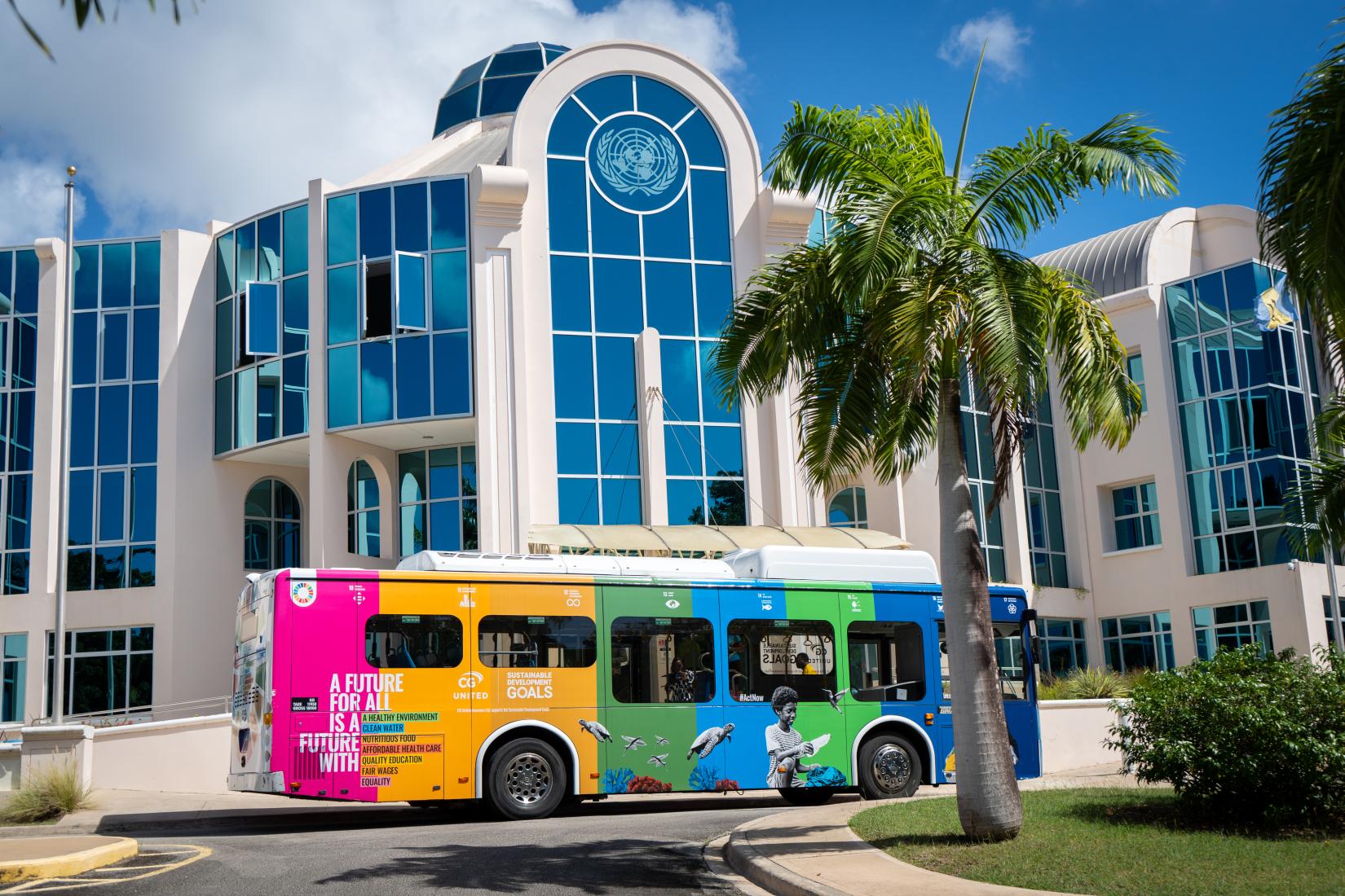 The SDG branded Electric Bus parked at the entrance of UN House Barbados.  