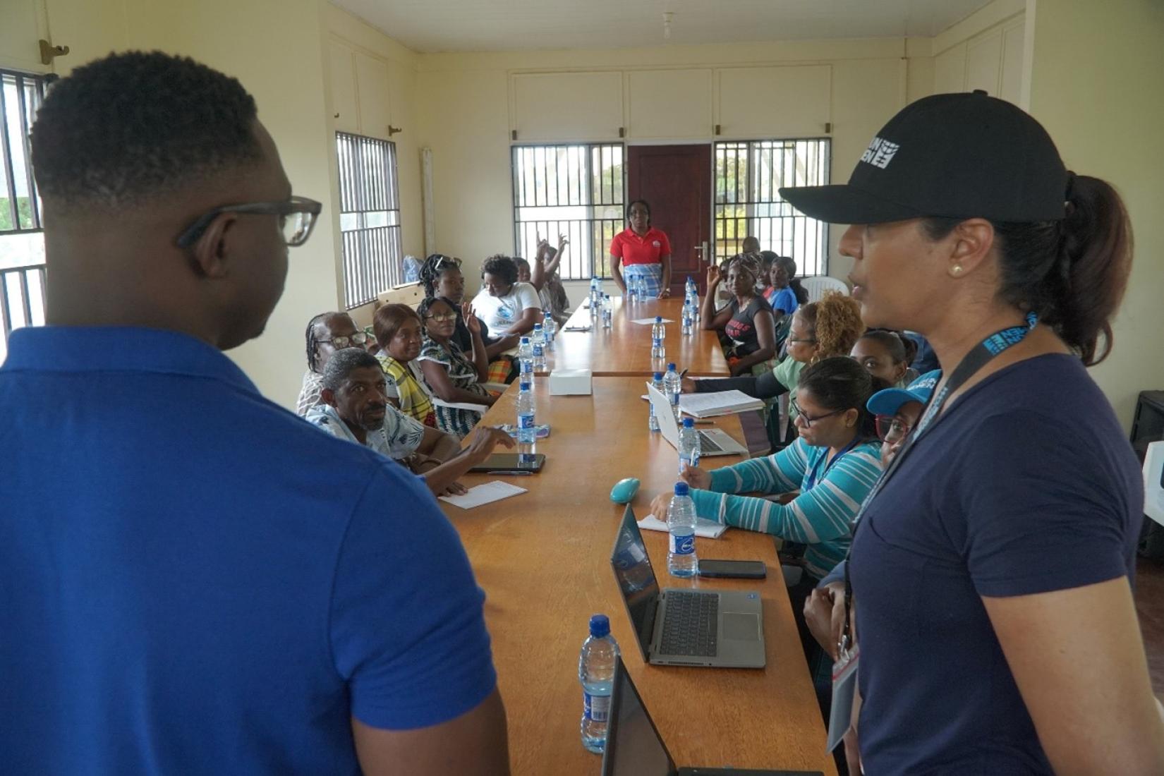 Je’nille Maraj, Planning Coordination Specialist at UN Women MCO Caribbean is aided by a translator to facilitate the focus group in Atjoni.