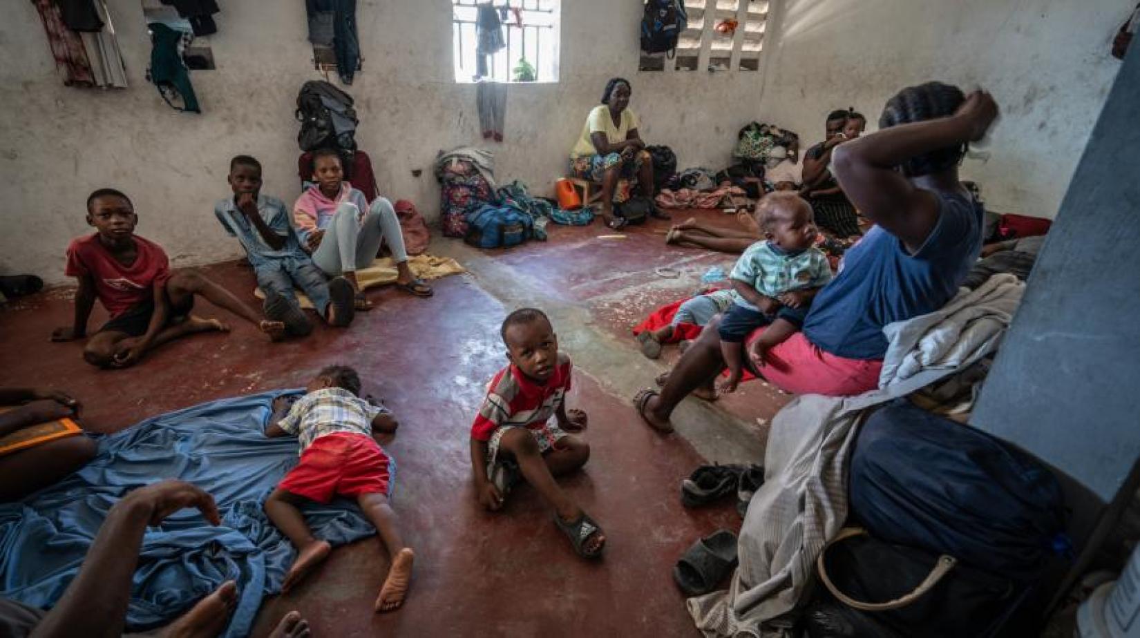 In downtown Port-au-Prince, men, women and children shelter in a boxing arena after fleeing their homes during gang attacks in August 2023. 