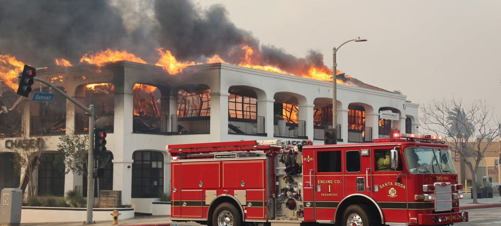 A bank building burns in Los Angeles, California.