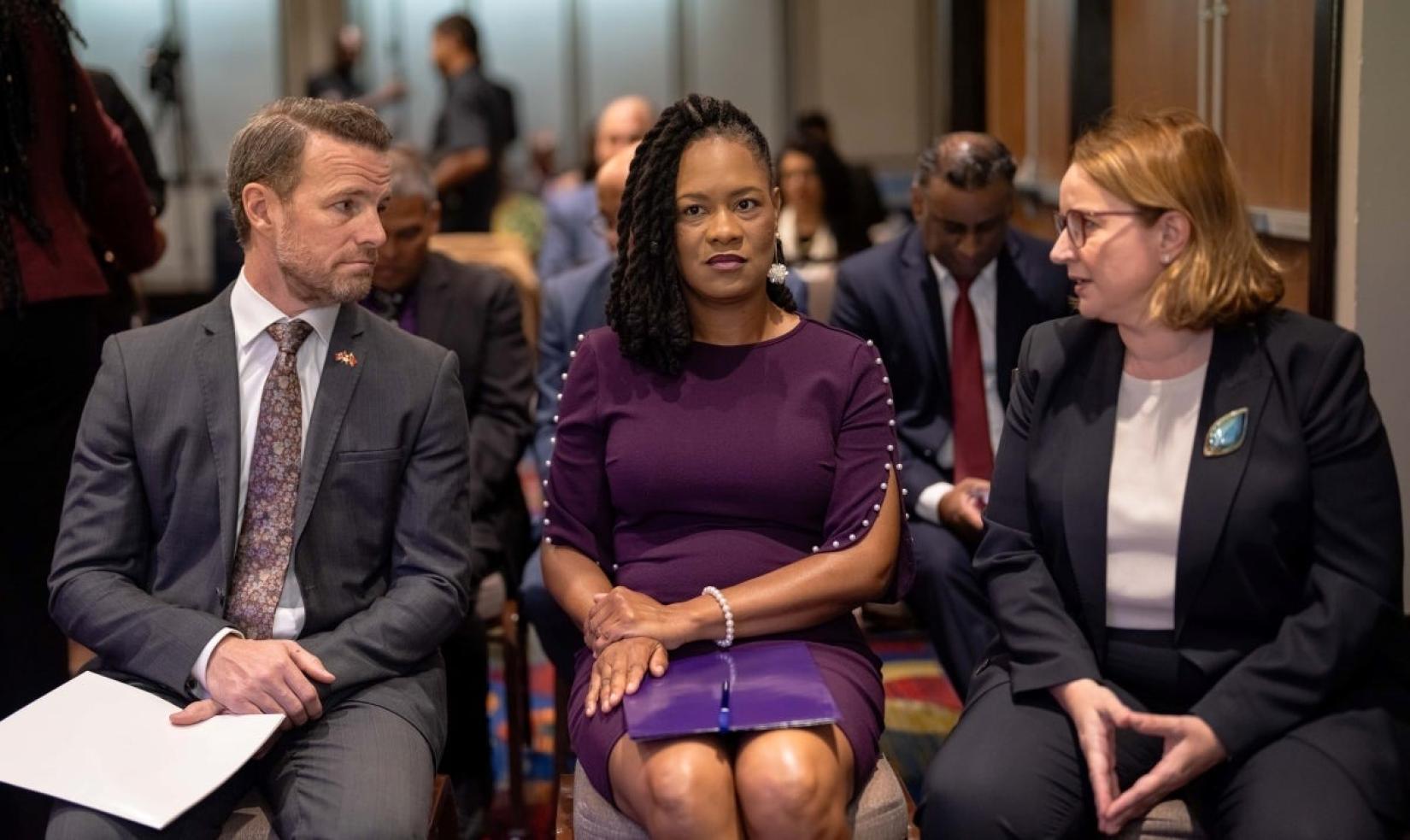 Prior to the start of the Launch of the Women, Peace and Security National Action Plan of Trinidad and Tobago, the Honourable Ayanna Webster-Roy, Minister in the Office of the Prime Minister with responsibility for Central Administrative Services Tobago, Gender and Child Affairs and the National AIDS Coordinating Committee (centre) engaged in conversation with His Excellency Michael Callan, High Commissioner for Canada to the Republic of Trinidad and Tobago (left) and Ms. Joanna Kazana, United Nations Resid