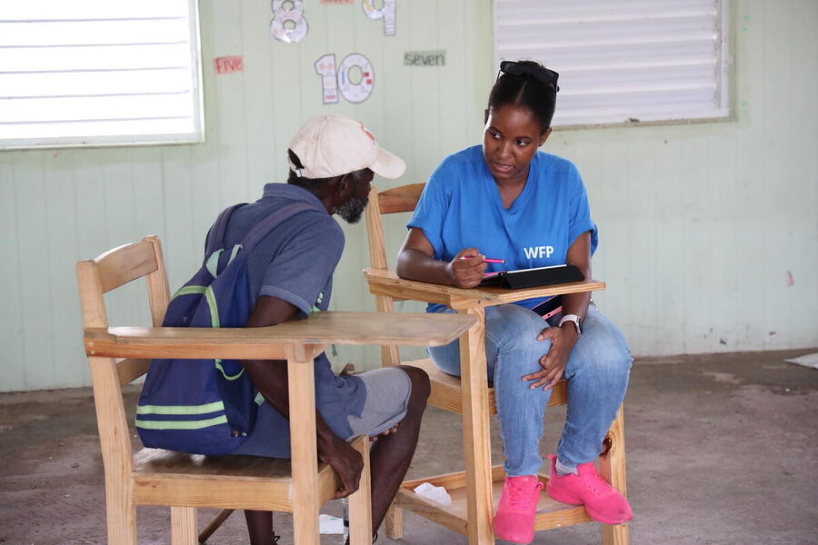 A resident of Union Island in Saint Vincent and the Grenadines registers for WFP assistance at a school in July 2024.