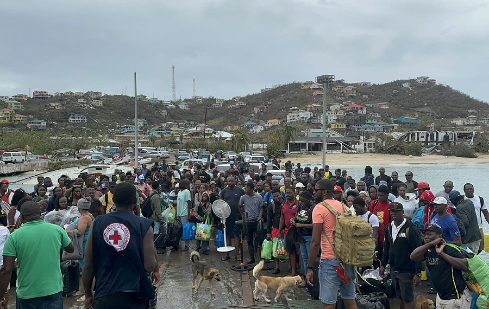 Residents of Union Island in Saint Vincent and the Grenadines prepare to board a ferry to reach shelter in the wake of Beryl.