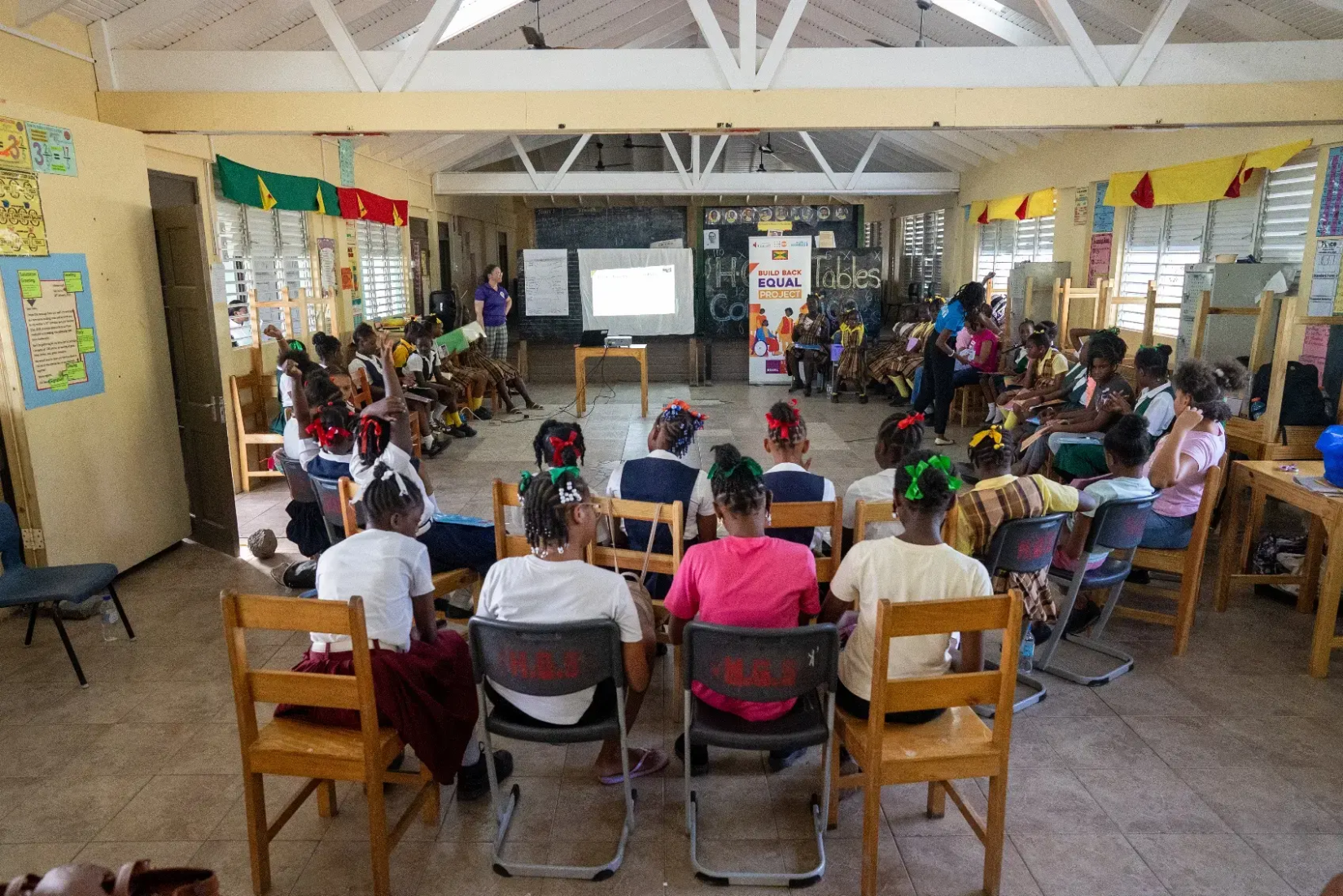 UN Women and Carriacou officials engaging with the girls, Grenada.Grenada.
