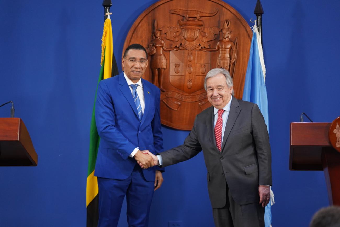Secretary-General António Guterres (right) and Prime Minister Andrew Holness of Jamaica shake hands prior to their press conference in Kingston, Jamaica.