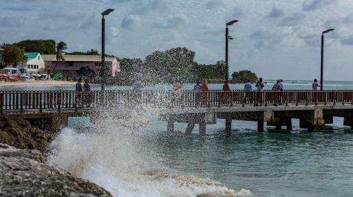 A wave crashes against a breakwall next to the Speightstown Jetty, in the north of Barbados.