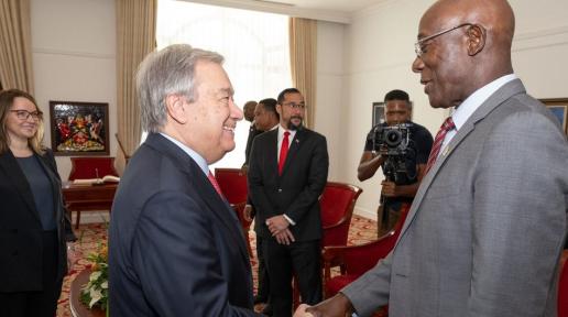 Secretary-General António Guterres (left) is greeted by Prime Minister Keith Rowley of Trinidad and Tobago where he came to address the 45th meeting of the Conference of the Heads of Government of the Caribbean Community (CARICOM).