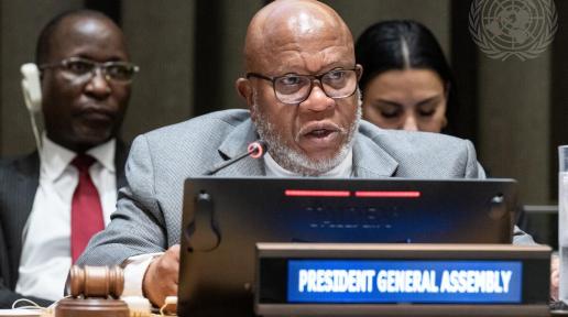 Dennis Francis, President of the seventy-eighth session of the General Assembly, speaks into microphone.