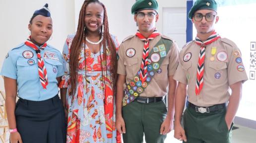 Four event attendees stand together for a photograph