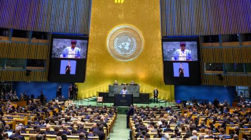 Philemon Yang (at podium and on screens), President of the 79th session of the United Nations General Assembly, addresses the opening of the Summit of the Future on 22 September 2024